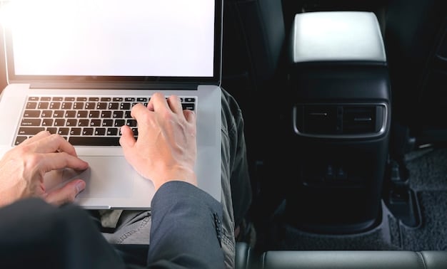 A hand pointing to a VIN number on a car's dashboard or door frame, with a laptop in the background open to a recall checker website.