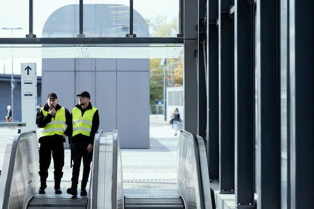 Security personnel, equipped with tactical gear, are conducting a thorough inspection of a public transit area, with passengers observing from a distance, conveying a sense of heightened vigilance and security presence.