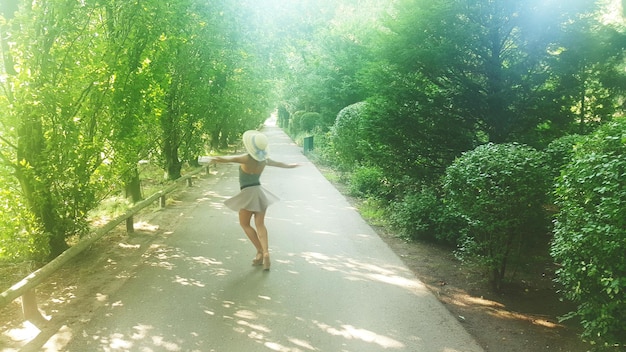 A dynamic image of an individual jogging in a park with a subtle, healthy glow on their face, surrounded by green trees and a clear sky. The focus is on movement and well-being, conveying the natural benefits of physical exercise.