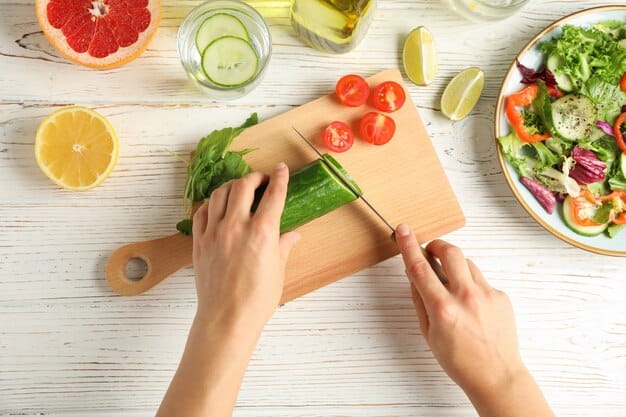 A person's hands preparing a vibrant salad with fresh vegetables and lean protein on a wooden cutting board, with a healthy kitchen background.