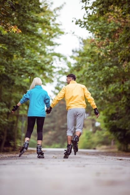 An older couple walking hand-in-hand in a park, indicative of healthy aging and active lifestyle.