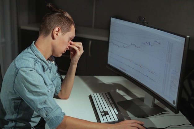 A worried person looking at a downward trending cryptocurrency chart on a laptop, symbolizing financial risk and volatility in the crypto market.