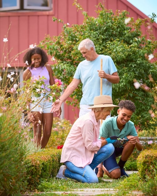A serene image of a family (multi-generational) gathered informally and smiling in a well-kept garden, symbolizing peace of mind and intergenerational wealth transfer through good estate planning.