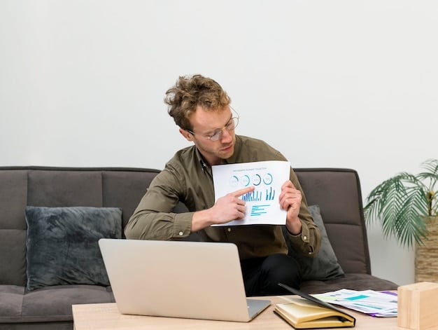 A person meticulously organizing financial documents and a laptop with a budget spreadsheet, representing careful financial planning.