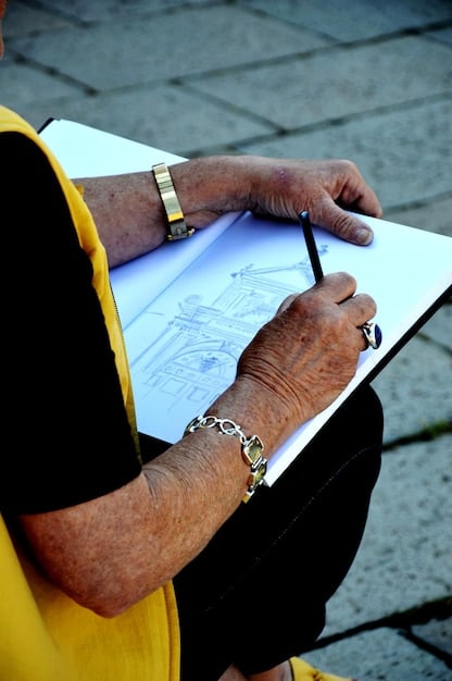 A person's hand filling out complex forms, with a pen and various application documents, illustrating the detailed nature of disability applications.
