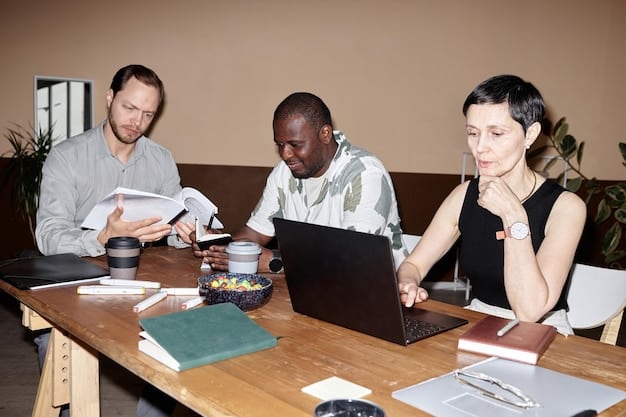 A diverse group of people sitting at tables, being assisted by volunteers with tax forms and computers, depicting a tax assistance center.