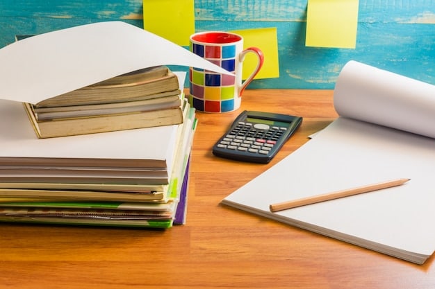 A calculator and scattered financial documents on a desk, representing the importance of financial planning and calculation for student loan borrowers. A pen is poised over a document.