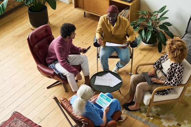 A diverse group of people sitting together reviewing documents, possibly representing a community center or a government assistance office.