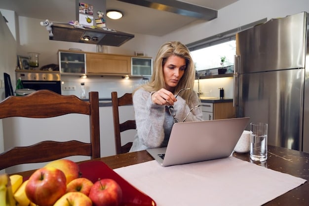 A person sitting at a kitchen table, methodically organizing important documents, including insurance policies and bank statements, into a waterproof clear folder, symbolizing proactive financial preparedness for disasters.